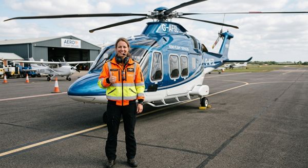Helicopter pilot giving a thumbs up before a flight